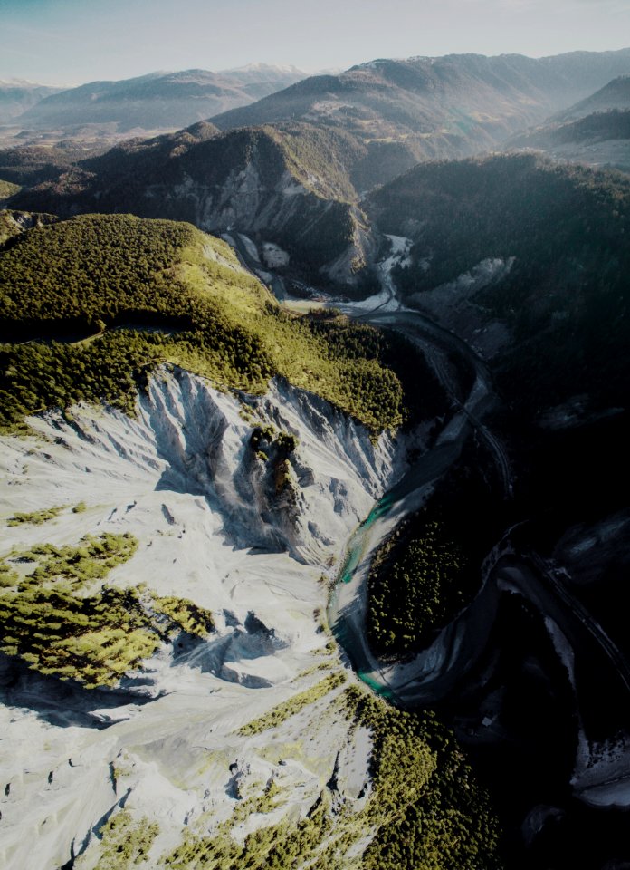aerial photography of rock mountain and river during daytime