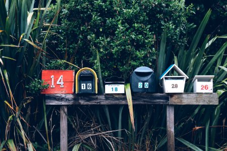 six assorted-color mail boxes photo
