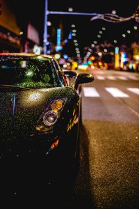 close photography of black convertible on road photo