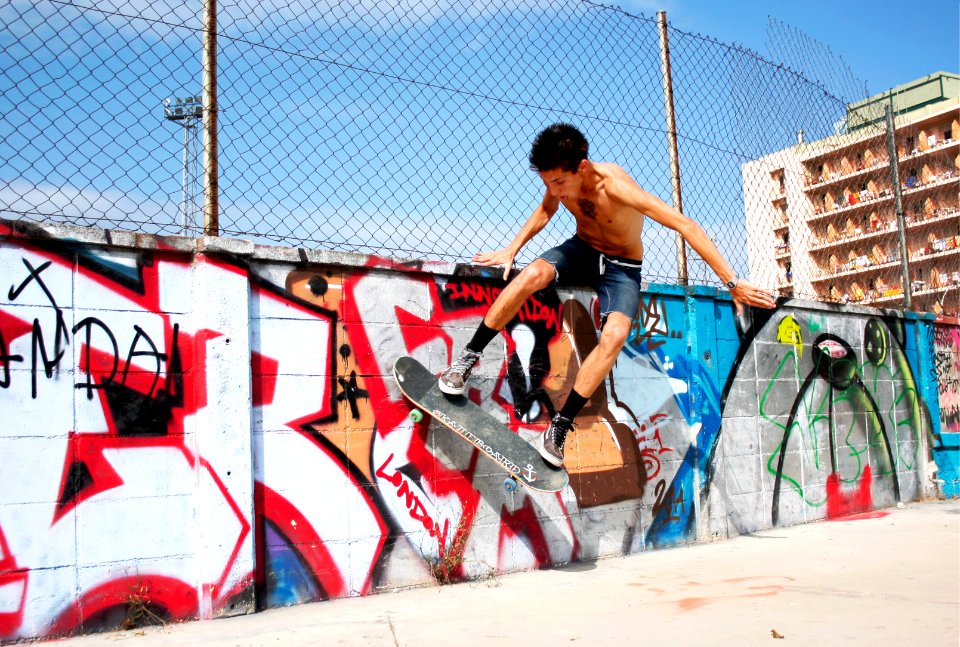 boy playing skateboard during daytime