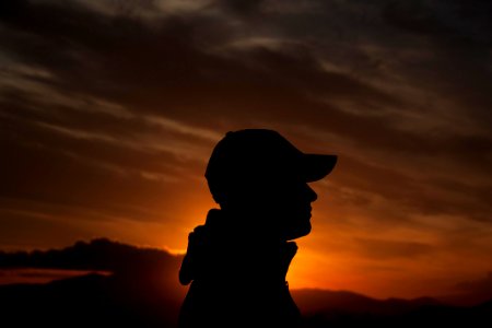 person's silhouette during golden hour