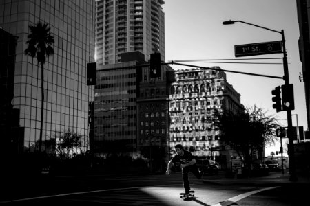 grayscale photography of person skateboarding during daytime photo