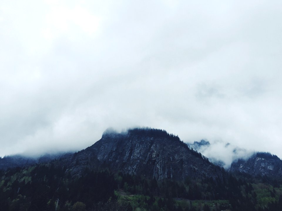 photo of clouds covering mountain