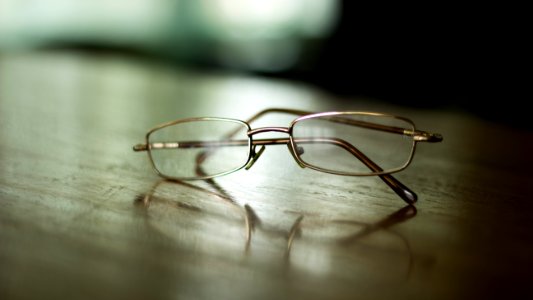 eyeglasses on table photo