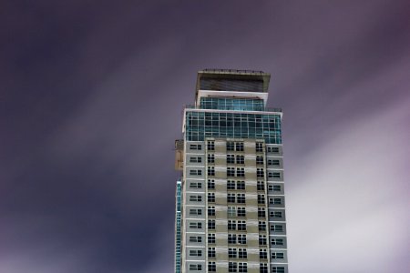high rise building under cloudy sky photo
