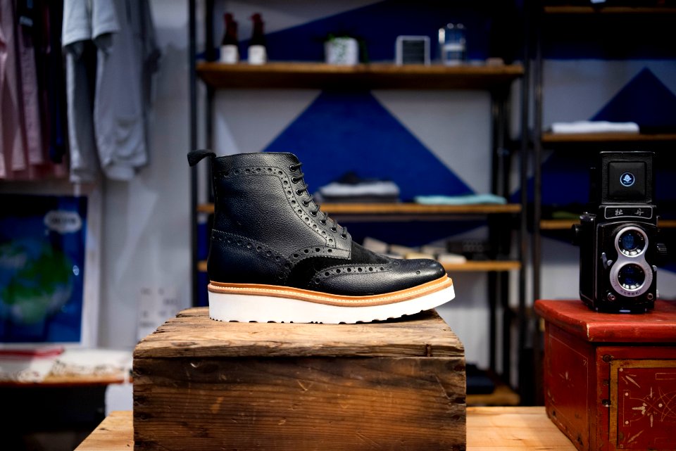 unpaired black and brown boot