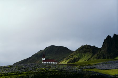 white and brown house near mountain photo