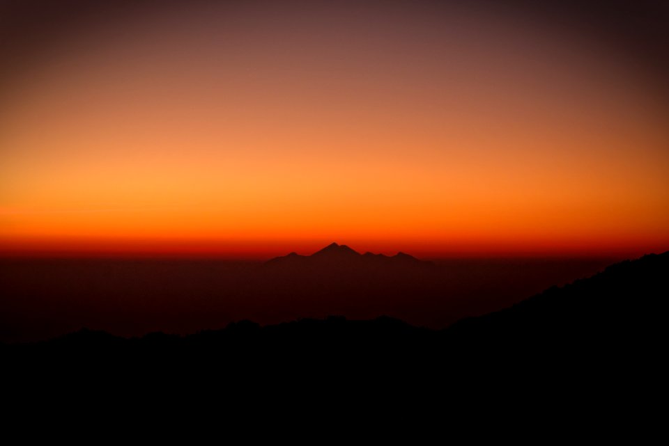silhouette photography of mountains during sunset