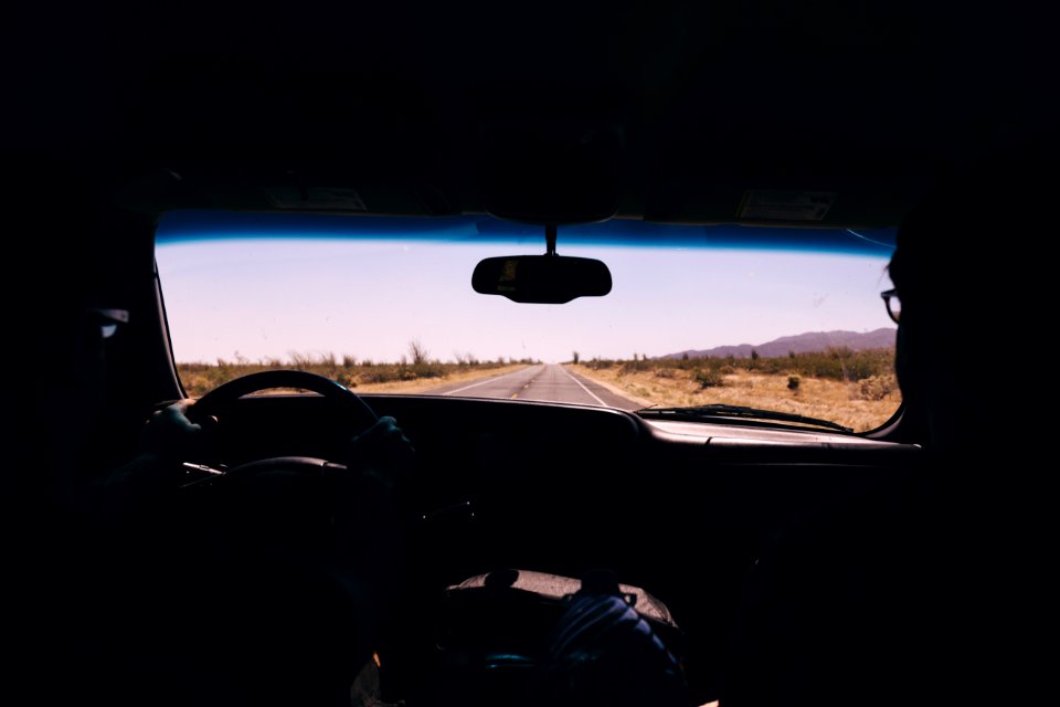 silhouette of person driving inside car