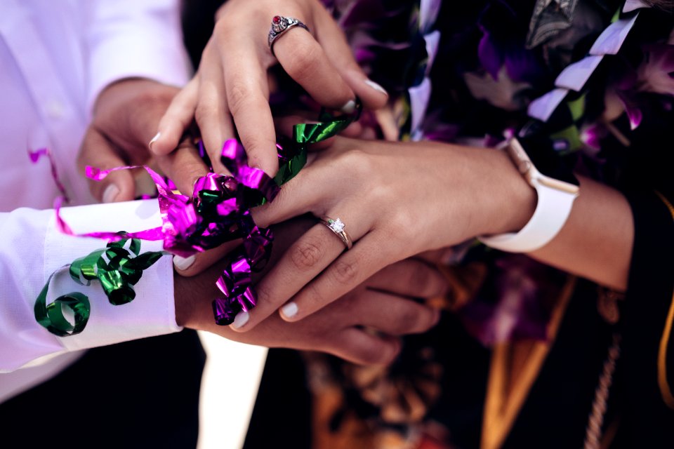 man and woman touching hands