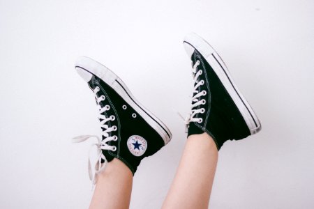 black and black and white Converse All Star high-top sneakers photo