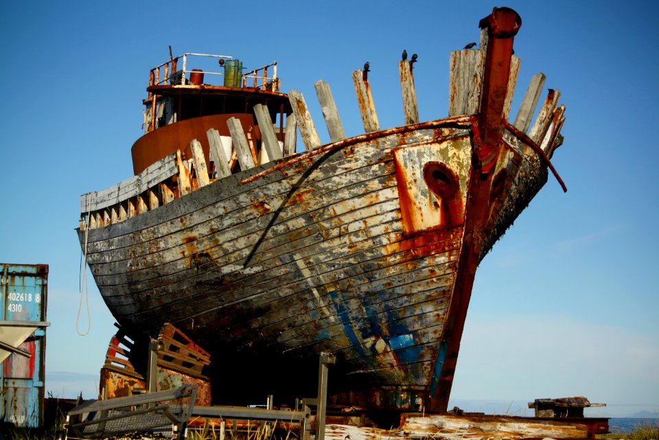 white and red docked boat during daytime photo