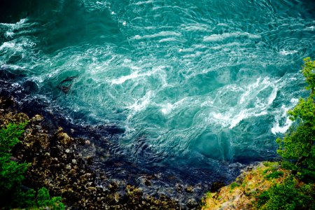 bird's-eye view photography of body of water smashing the rocks photo