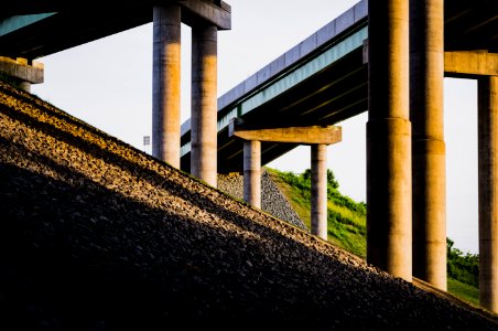 low-angle photography of concrete bridge