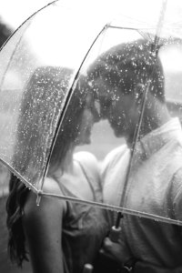 couple under clear umbrella