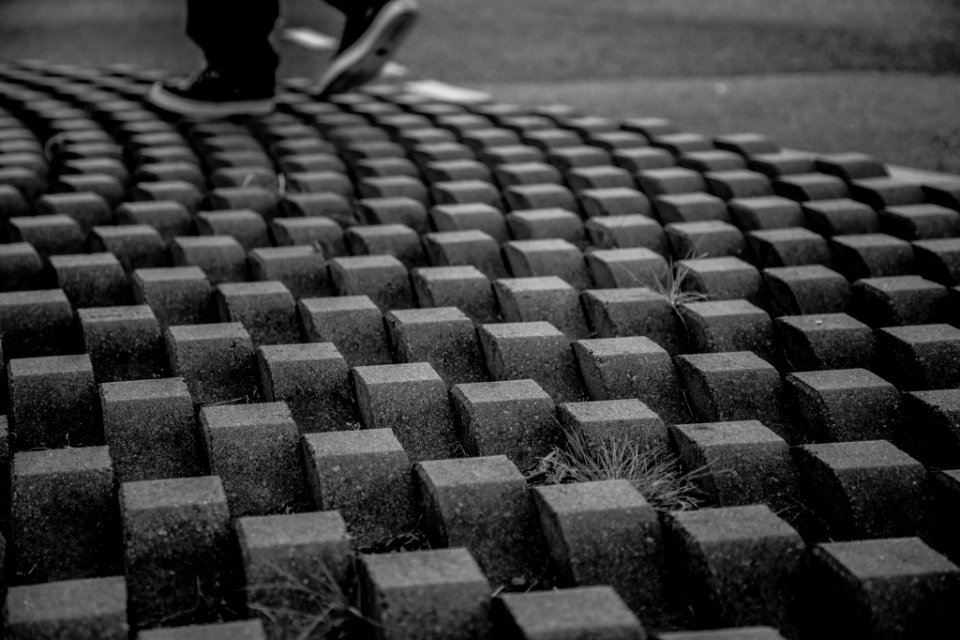 person standing on concrete block