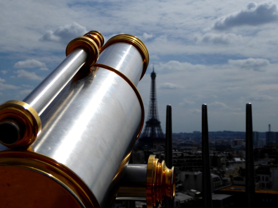 focus photography of telescope on Eiffel Tower, Paris photo