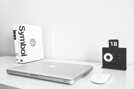 silver MacBook and black JBL photo