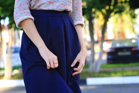 close-up photography of woman wears blue skirt at daytime photo