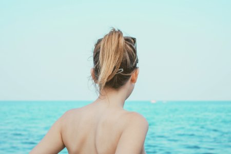 woman looking at sea at daytime photo