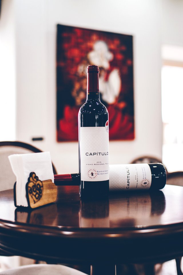selective focus photography of two Capitulo bottles on table