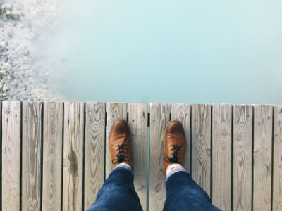 person standing on dock photo