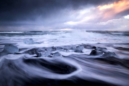 ocean waves under gray cloudy sky during daytime photo