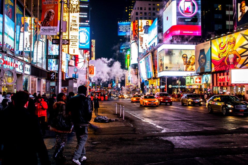 people walking beside buildings