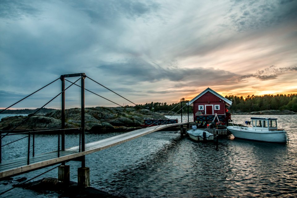 white boat near red and gray structure