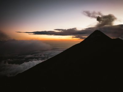 silhouette of mountain with clouds photo