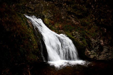 waterfall on green rocks photo