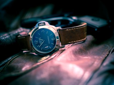 selective-focus photography of black chronograph watch