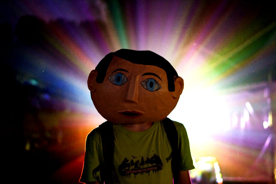 man wearing green t-shirt and backpack