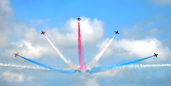 five assorted-color airplane sky show during daytime