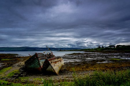 landscape photography of two boats near body of water photo