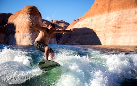 man riding surfboard during daytime photo
