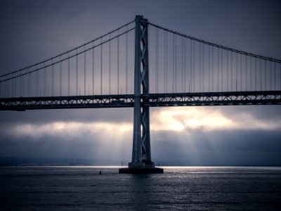 architectural photo of gray metal bridge during daytime photo