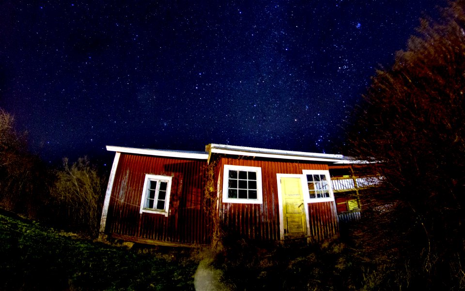 low angle view photography of brown house during night time