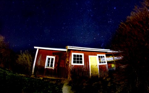 low angle view photography of brown house during night time
