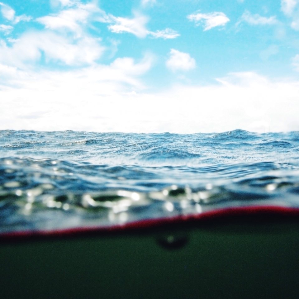 body of water under cloudy sky photo