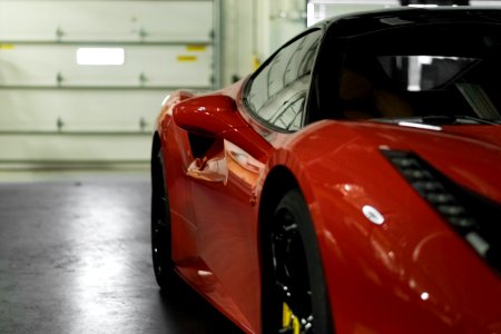 close-up photography of red coupe photo