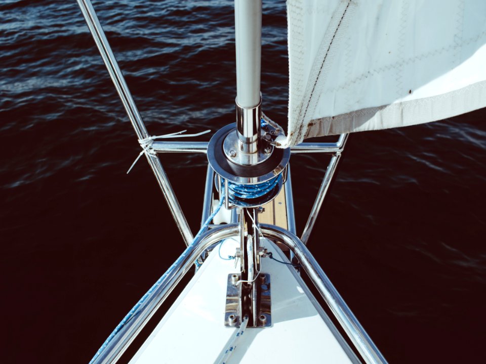 silver and white boat on body of water photo