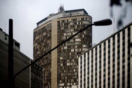 utility post near high rise building photo