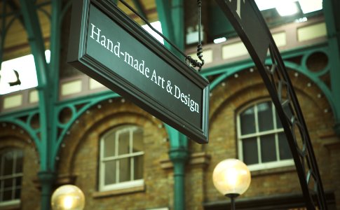 selective focus photo of Hand-made Art & Design signage photo