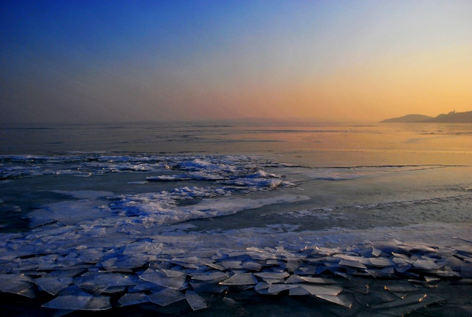 body of water during golden hour photo