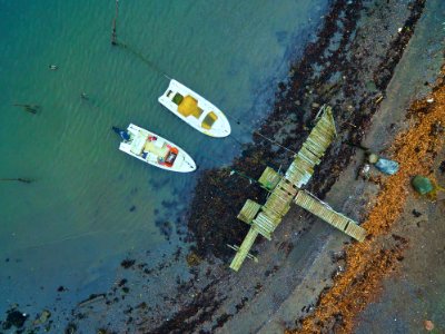 aerial view of two white boats on body of water