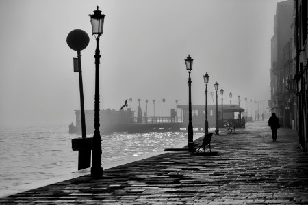 silhouette person walking at walkway