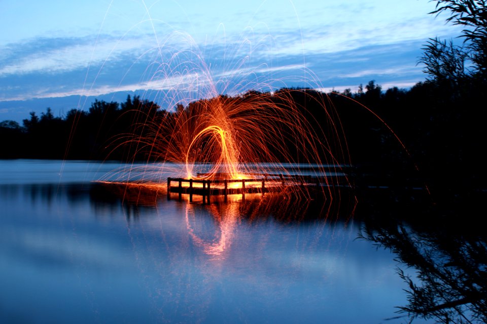 slow shutter photo of fire dance