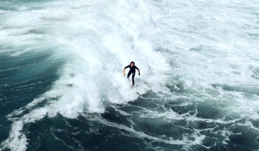 person surfing at waves photo