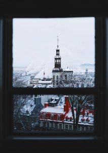 brown and white tower building near smoke at daytime